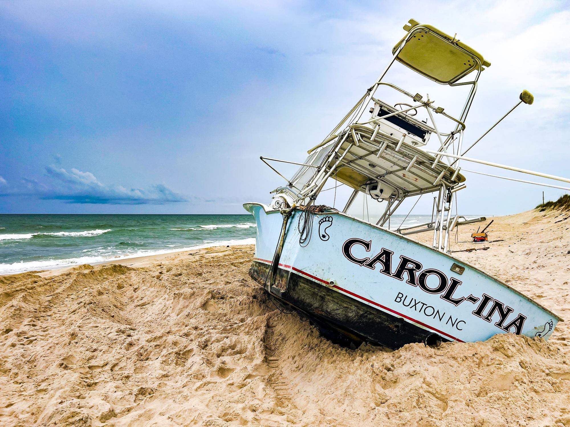 The beached fishing boat CAROL-INA resting in the sand near Buxton